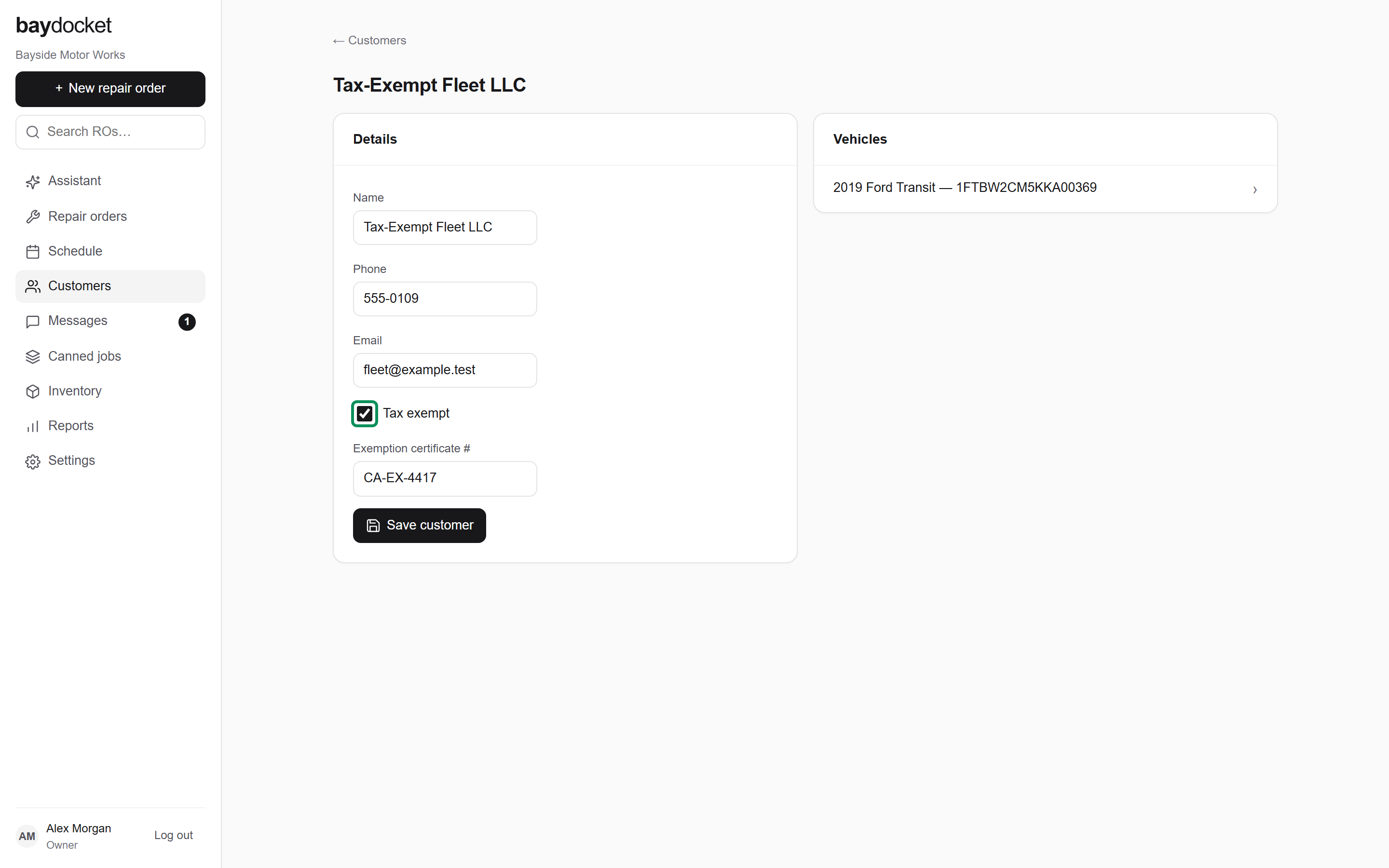 A customer record with contact details, the tax-exempt fields, and the vehicle list